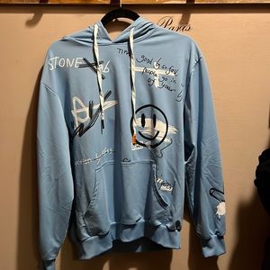 Blue hoodie with writing and designs